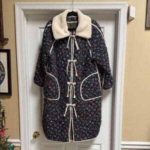 THE GREAT. Navy Floral Quilted Puffer Coat with Cream Trim